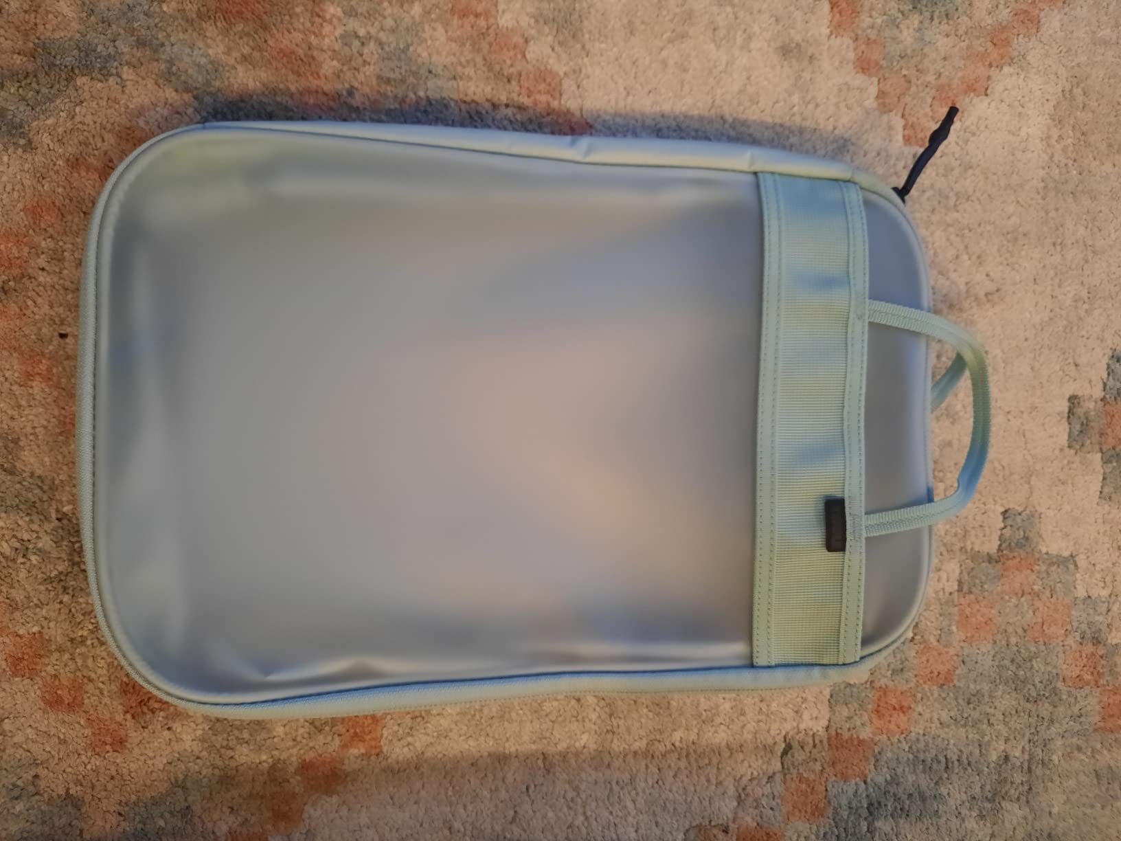 Solid carry-on with a small flaw